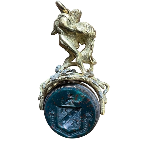 1160 - An impressive swivel seal locket In unmarked gold cast and chased as Hercules and the Lion. The open... 