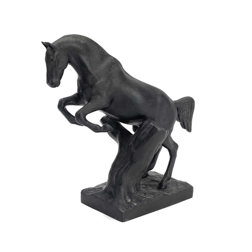 117 - A 20th century Russian cast iron model of a leaping horse. Impressed marks to base, height 19cm.