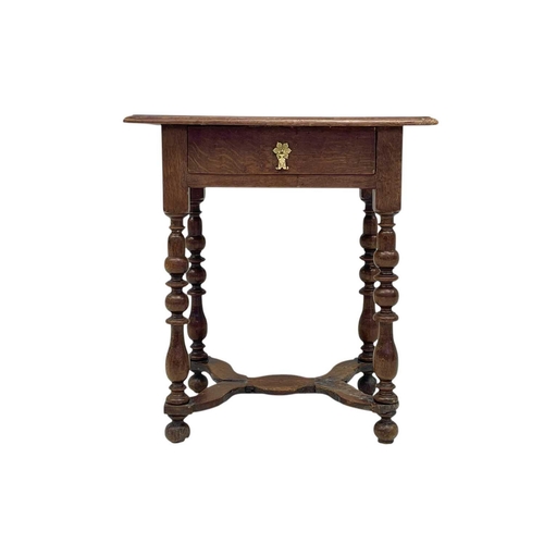 1176 - A William & Mary period oak side table. Fitted a single drawer and raised on cup and cover, and balu... 