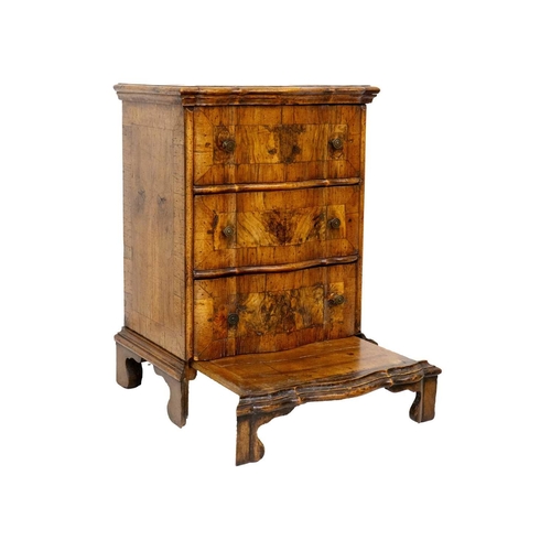 1179 - An Italian walnut and crossbanded prie dieu chest Mid 18th century, with a double serpentine front f... 