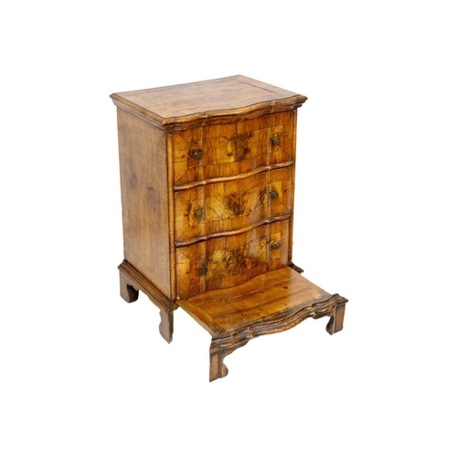 1179 - An Italian walnut and crossbanded prie dieu chest Mid 18th century, with a double serpentine front f... 