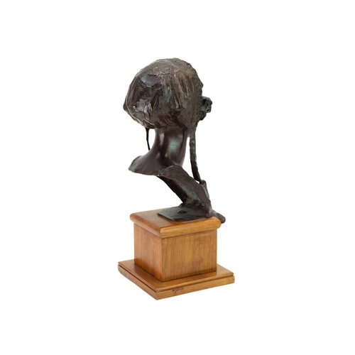 1186 - Edoardo Rubino (1874-1951). A bronze bust of a young woman, Early 20th century, cast wearing a bonne... 