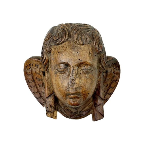 1191 - Two French walnut Angel heads. 16th century, with carved wings and drapery, height 13cm. Mollie & Gr... 