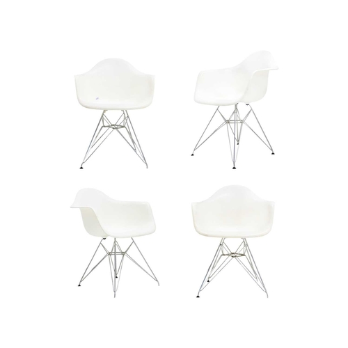 1196 - After Charles and Ray Eames, four DAR style armchairs. White plastic moulded shells on chrome Eiffel... 