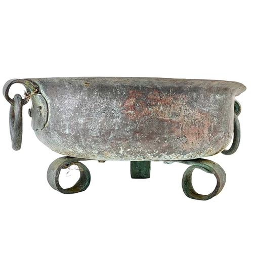 1224 - A Continental copper brazier. 18th century, with loop handles and three scroll feet, height 21cm, di... 