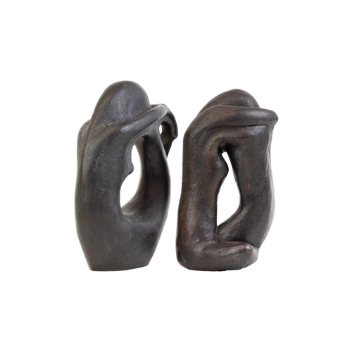 129 - Two modernist black painted terracotta sculptures. Height 23 and 22cm (2).