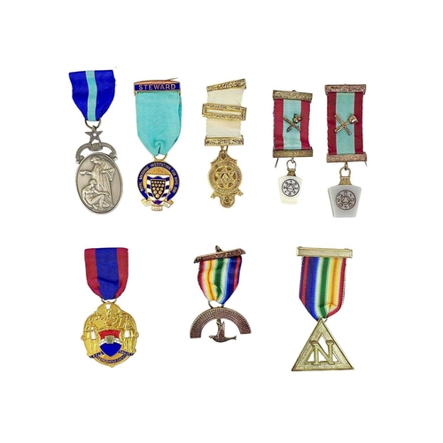 135 - Masonic regalia and jewels, contained in a leather case. Including two Free Masonic Aprons, medals, ... 