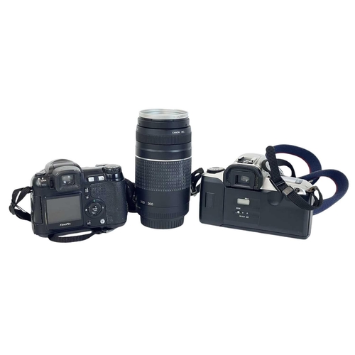 147 - A Canon EOS 300 camera. With a 28-90mm Zoom lens1:4-5.6, together with a 75-300 mm zoom lens, two ca... 