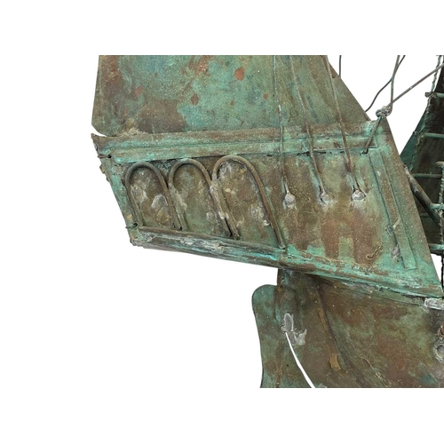 148 - A copper galleon weather vane mount. Early 20th century, the three masted ship with verdigris patina... 