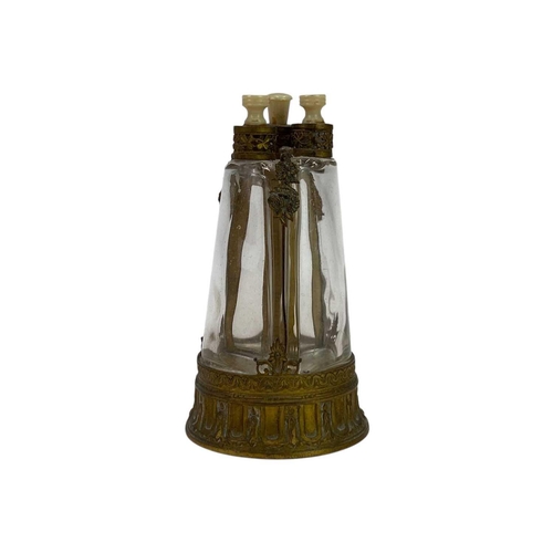 150 - A French brass triple glass scent bottle. With ivorine stoppers, height 12.5cm.