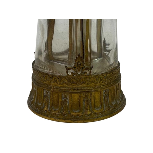 150 - A French brass triple glass scent bottle. With ivorine stoppers, height 12.5cm.