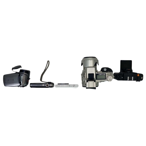 159 - A Minolta Dimage 7i digital camera. Other cameras, including Panasonic Lumix DMC-XS1, Minox 35ML, Ca... 