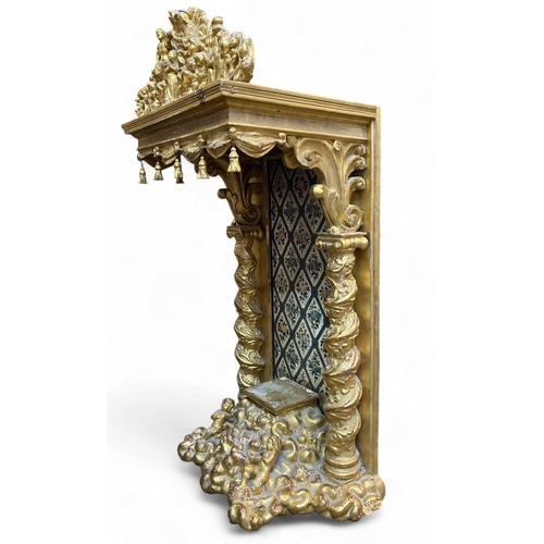 174 - A carved wood and gilt gesso baroque period tabor monstrance stand/throne. The pediment with the cen... 