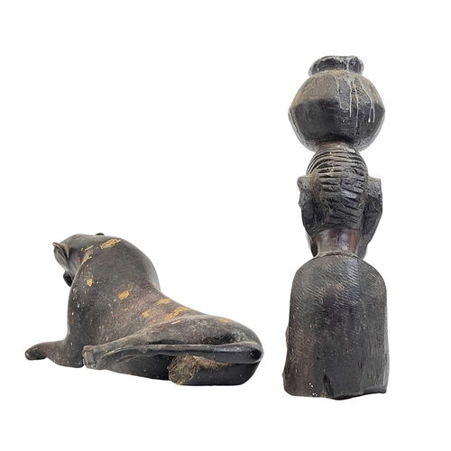 177 - An African hardwood carved leopard. Length 41cm, together with a hardwood female figure. (2)