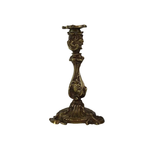 18 - A pair of French rococo style brass candlesticks. 19th century, with typical leaf and scroll casting... 