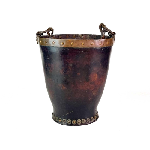 23 - A leather and copper bound riveted fire bucket. With leather handle strap, height 30cm.