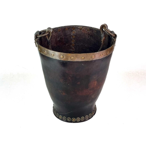 23 - A leather and copper bound riveted fire bucket. With leather handle strap, height 30cm.