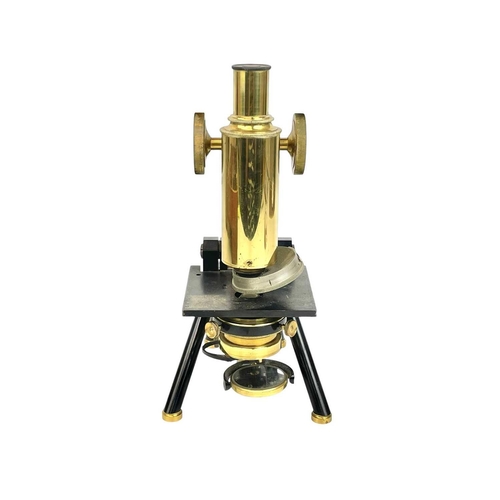 236 - A brass and black lacquered compound microscope by J Swift & Son, London. With rack and pinion cours... 