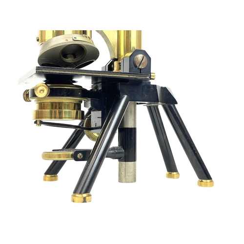 236 - A brass and black lacquered compound microscope by J Swift & Son, London. With rack and pinion cours... 