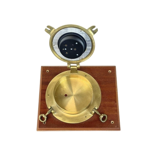 241 - A brass Royal Mariner bulkhead barometer. Diameter 19cm mounted on teak.