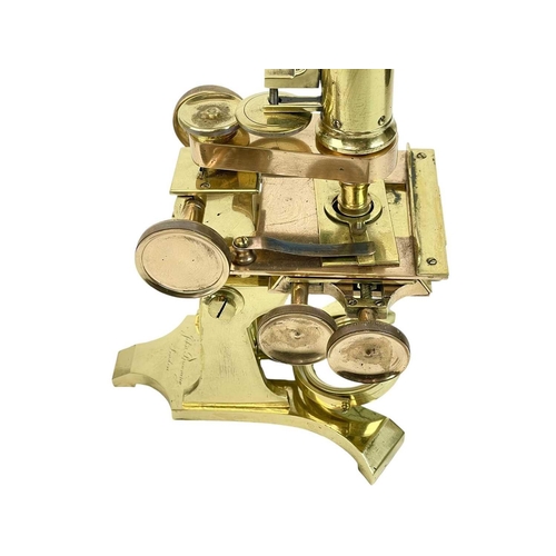 242 - A Victorian brass compound microscope by John Browning. Circa 1870, in a mahogany case with addition... 