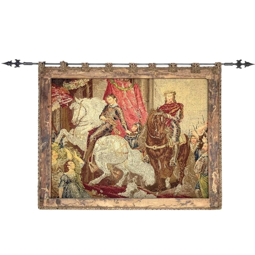 265 - A Victorian Berlin needlework embroidery of the return of the king. 84X106cm, with a hanging pole.