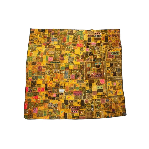 269 - A large Indian cotton mirrored patchwork textile panel. 225cm x 225cm.