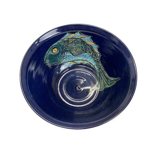 293 - Peter O'Neil a large studio pottery bowl. Decorated to the interior with a fish, diameter 29cm.