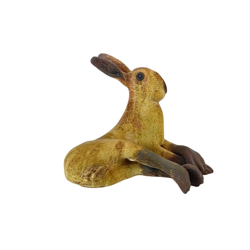 298 - A Michelle Cowmeadow studio pottery hare. With textured unglazed finish and brown markings, length 3... 