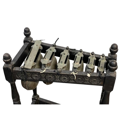 31 - An oak framed xylophone or metallophone. Circa 1920, with six copper resonators, with brass bars, wi... 