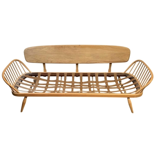 327 - An Ercol blond beech and elm studio couch or day bed. Model number 355, height 77cm, width 206cm, de... 