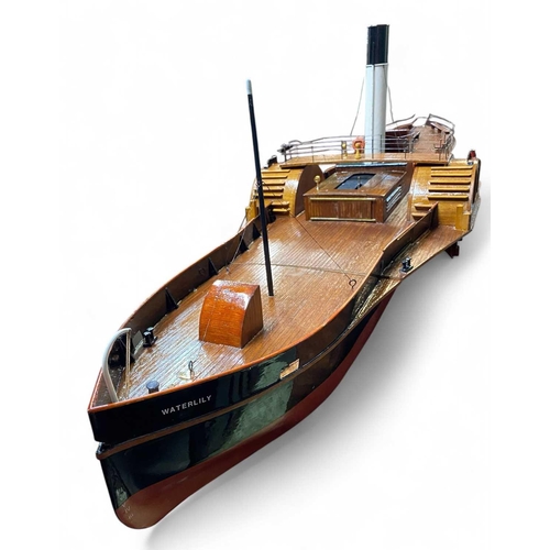 33 - A Scratch built model paddle steamer 'Waterlilly'. Mid 20th century, with a painted tin hull and pla... 