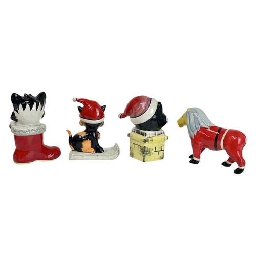 346 - A Lorna Bailey pottery Christmas Cat. Riding on a toboggan, height 12cm together with two other Lorn... 