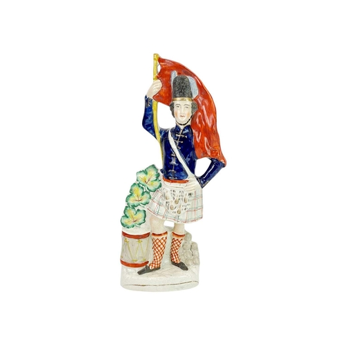 414 - A Victorian Staffordshire Crimea figure of a Highlander. Height 41.5cm together with a Victorian pot... 