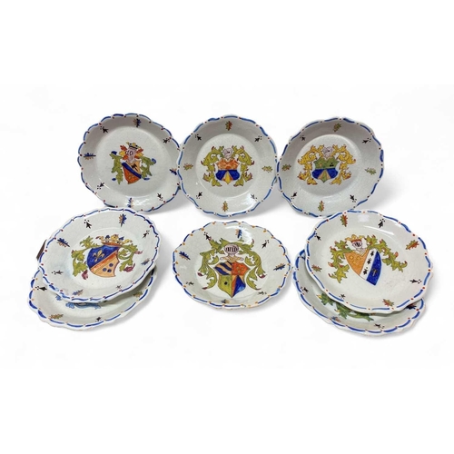 419 - A set of eight French faience armorial plates. 20th century, with painted decoration, diameter 25cm.