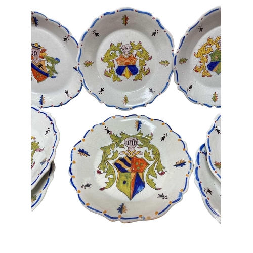 419 - A set of eight French faience armorial plates. 20th century, with painted decoration, diameter 25cm.