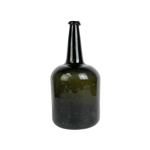 42 - A large green glass mallet shape wine bottle. Late 18th century, height 36cm.