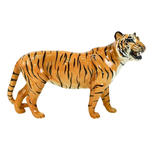 429 - A Beswick figure of a tiger. Length 29cm.