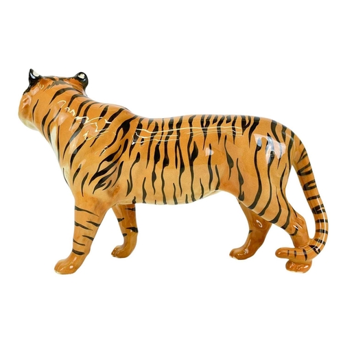 429 - A Beswick figure of a tiger. Length 29cm.