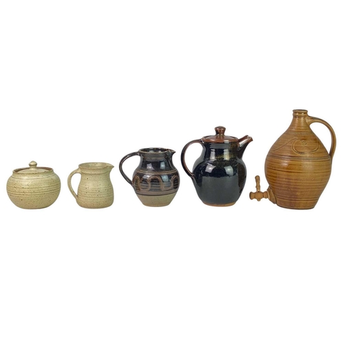 433 - A collection of Winchcombe Pottery Ten pieces in total. Four jugs, a coffee pot, suger jar, three pl... 