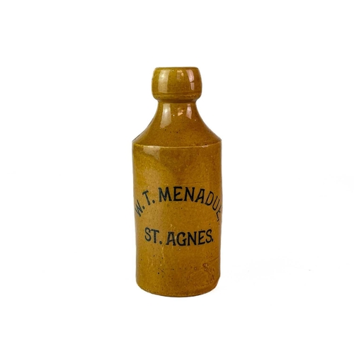 455 - A stoneware Ginger Beer bottle W.T. Menadue St Agnes. Height 17.5cm.