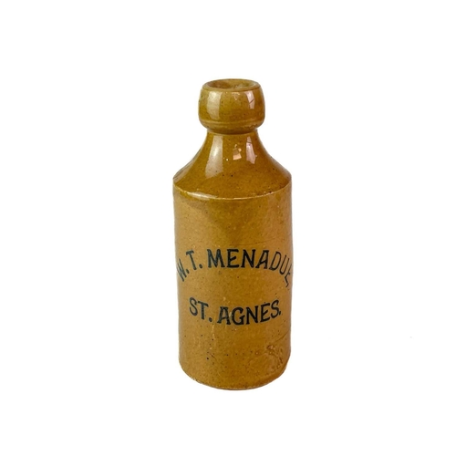 455 - A stoneware Ginger Beer bottle W.T. Menadue St Agnes. Height 17.5cm.