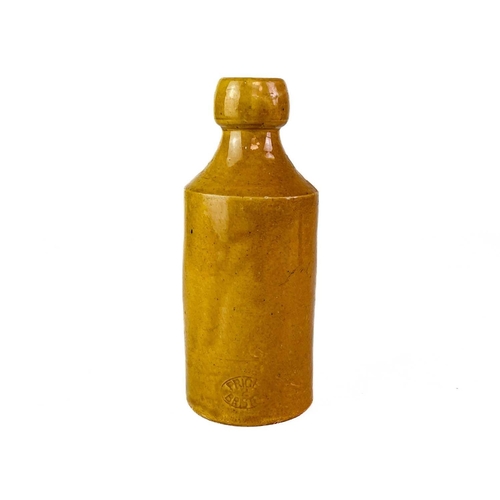 455 - A stoneware Ginger Beer bottle W.T. Menadue St Agnes. Height 17.5cm.