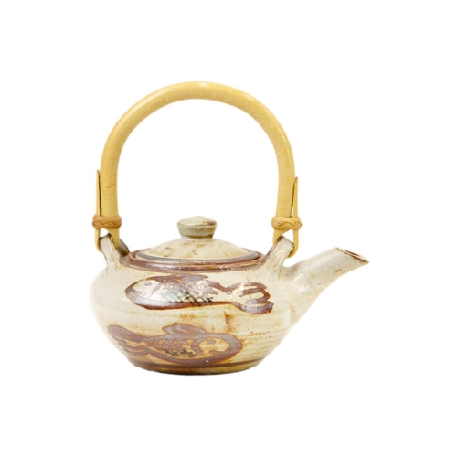 470 - Wenford Bridge An Ara Cardew small teapot, decorated with fish, cane handle, height 16cm, a jug by t... 