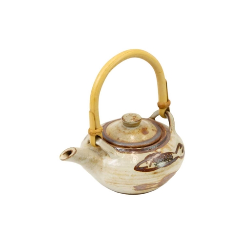 470 - Wenford Bridge An Ara Cardew small teapot, decorated with fish, cane handle, height 16cm, a jug by t... 