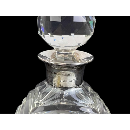 471 - An Art Deco cut glass and silver mounted decanter and stopper. With a stepped shoulder, Birmingham, ... 