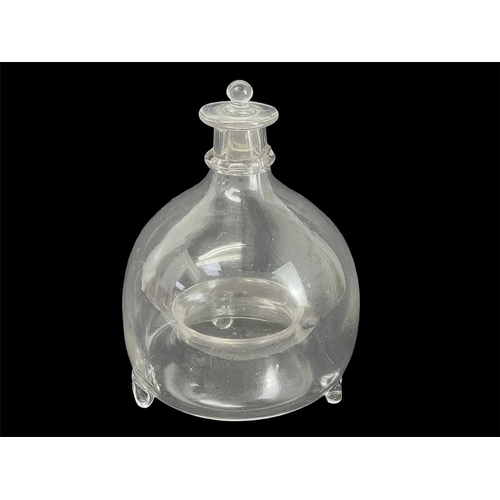 472 - A 19th century glass wasp trap and stopper. Height 18cm diameter 13cm.