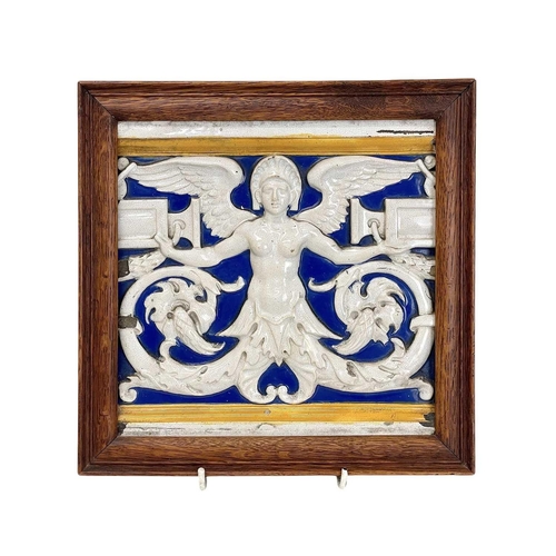 479 - A Minton majolica relief tile. Depicting a winged caryatid in an oak frame, frame size 24cm x 24cm, ... 