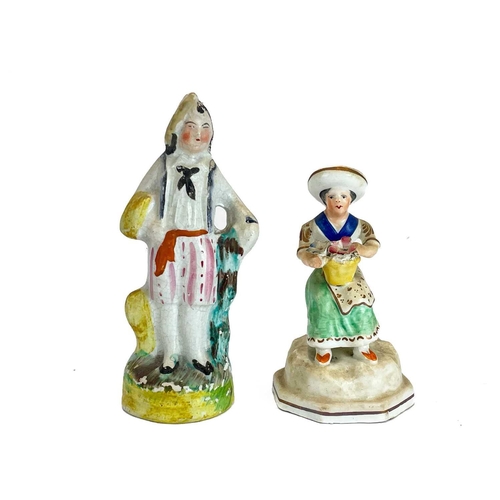 486 - A Victorian Staffordshire pottery flat back figure group of a harvest couple. Height 34cm together w... 