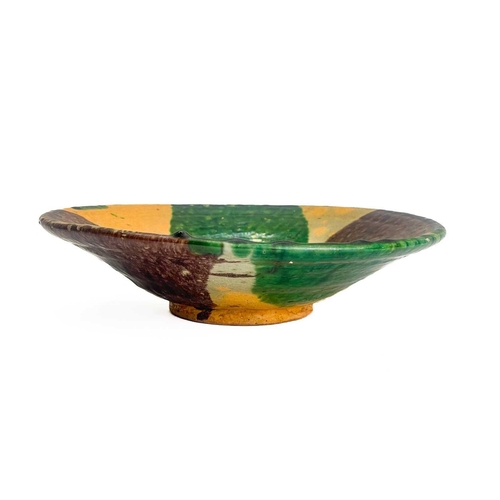 495 - An Afghan pottery dish. With green and umber glaze diameter 26cm together with a matching bowl. (2)